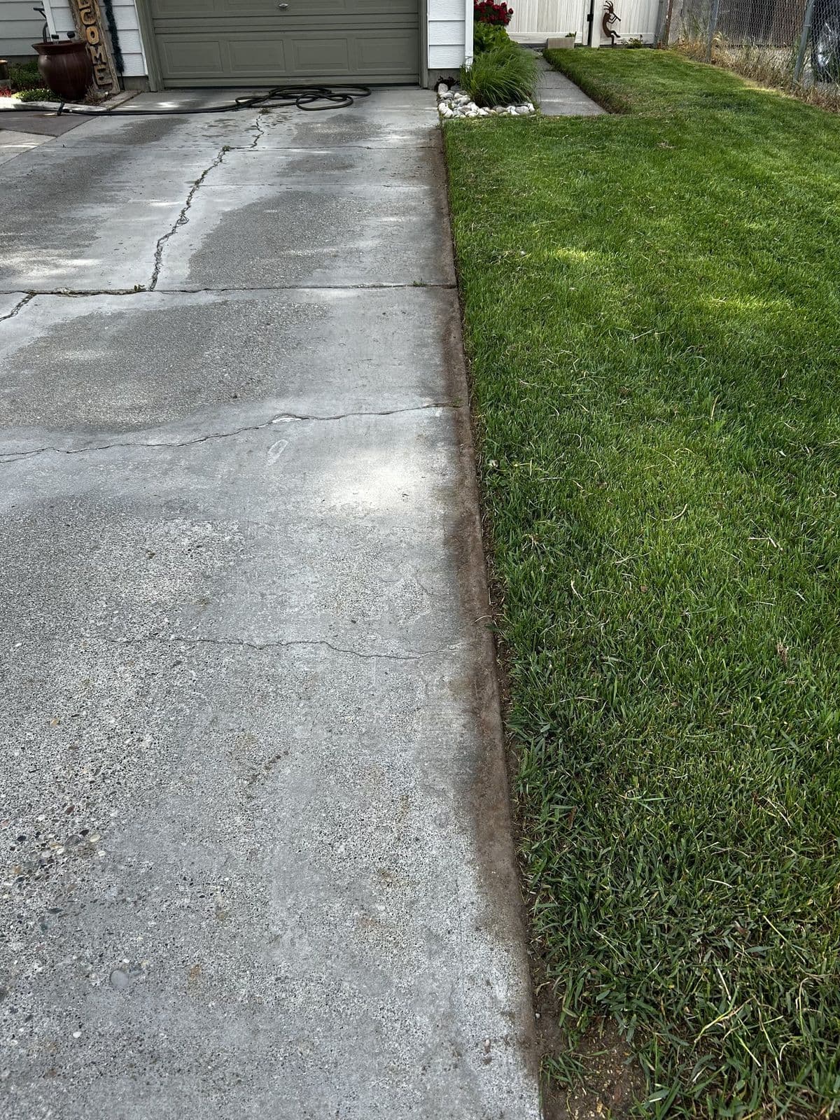 Rigby, ID — Clean concrete edge along sidewalk in Rigby, Idaho — Young Buck Lawn Care