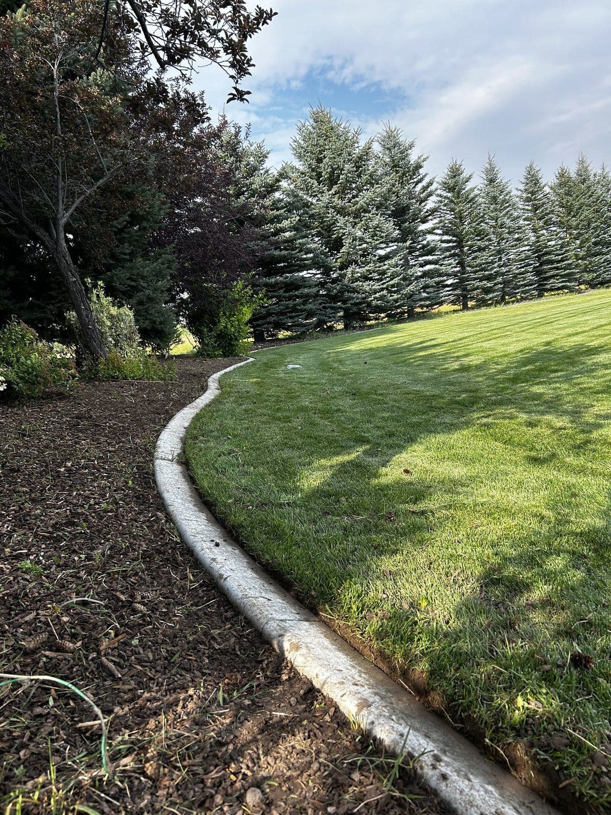 Clean lawn and bed line after weed removal — Young Buck Lawn Care, Rexburg, Idaho